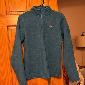 Patagonia 1/4 zip up fleece/sweater. One small hole on front.